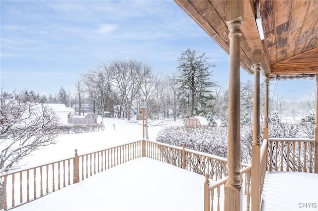 view of yard layered in snow