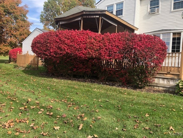 view of side of property with a yard