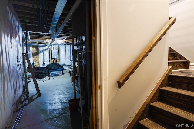 stairway featuring concrete floors