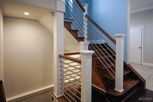 staircase featuring recessed lighting, baseboards, and ornamental molding