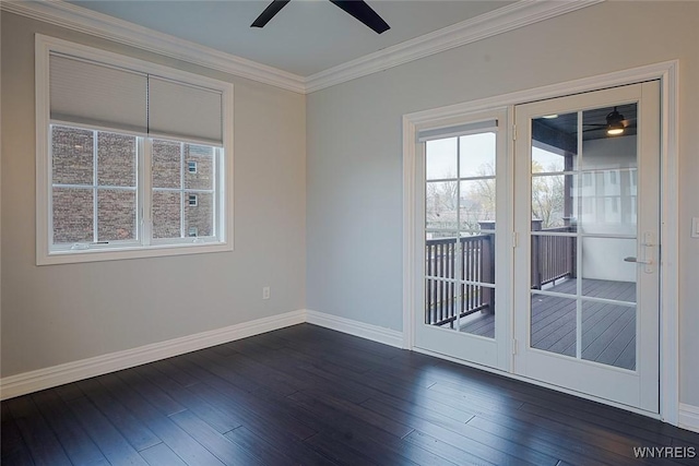 unfurnished room with baseboards, a ceiling fan, crown molding, and dark wood-type flooring