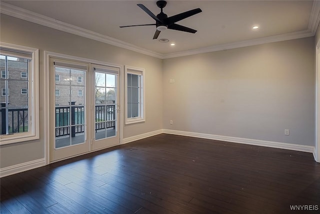 unfurnished room featuring ornamental molding, baseboards, and dark wood-style flooring