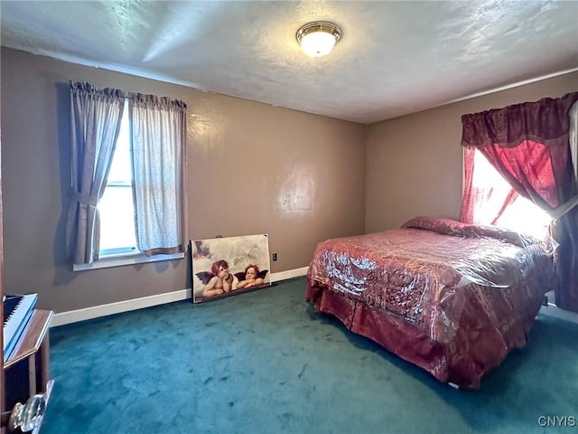 bedroom with carpet flooring and baseboards