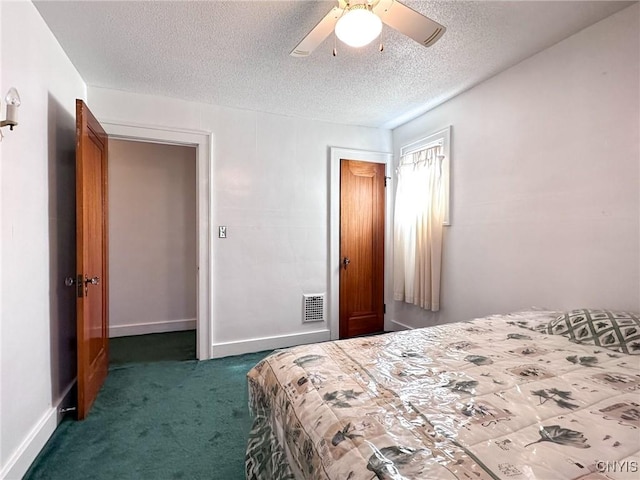 bedroom with a textured ceiling, ceiling fan, carpet floors, visible vents, and baseboards