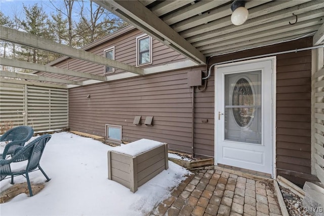 view of snow covered property entrance