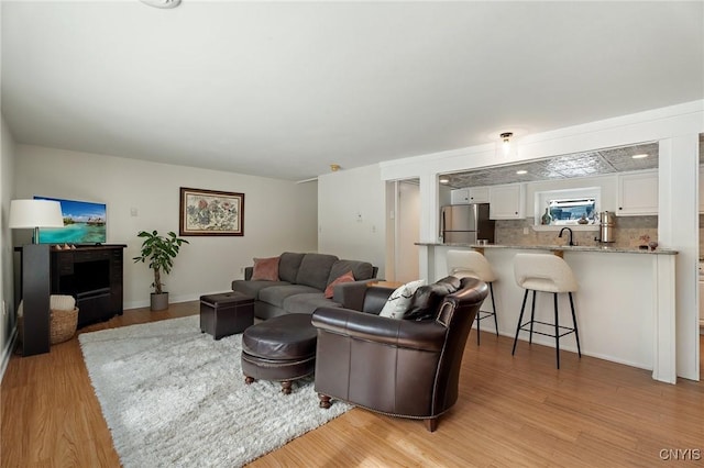 living area featuring light wood-style flooring