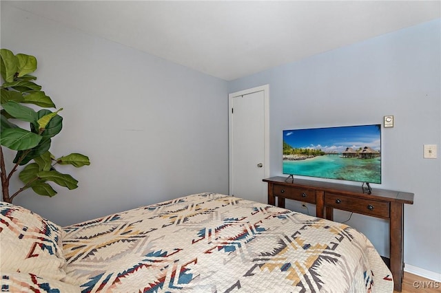 bedroom with wood finished floors