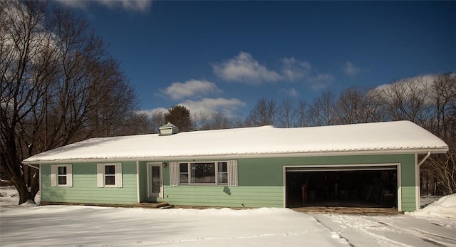 ranch-style home featuring an attached garage