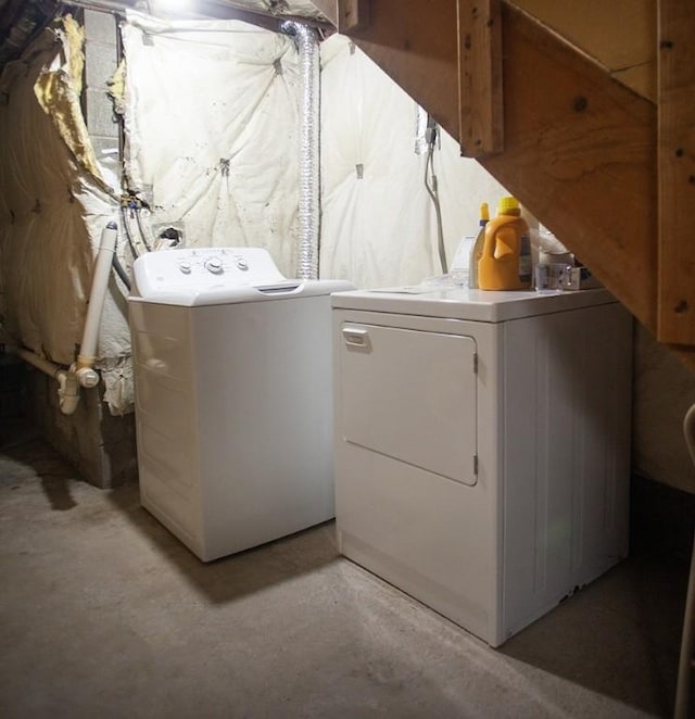 washroom featuring laundry area and washing machine and clothes dryer