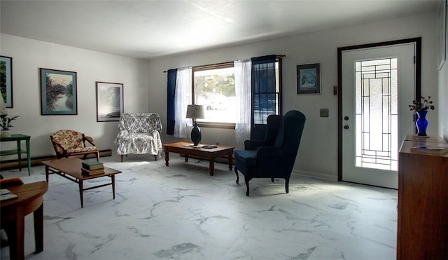 sitting room with marble finish floor