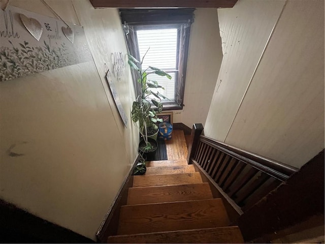 staircase with wood finished floors