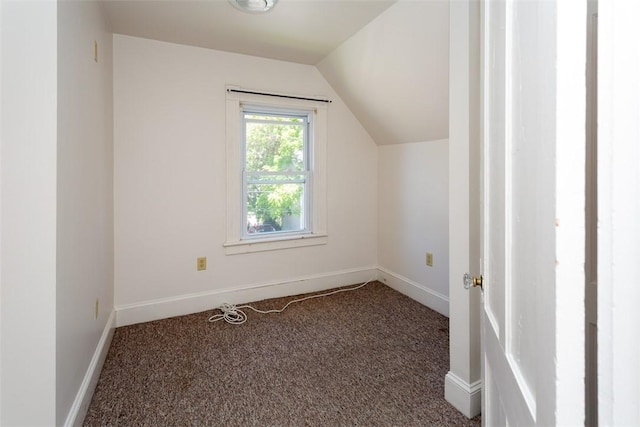 bonus room featuring lofted ceiling, baseboards, and carpet flooring