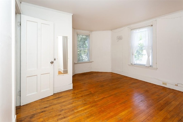 empty room with hardwood / wood-style floors