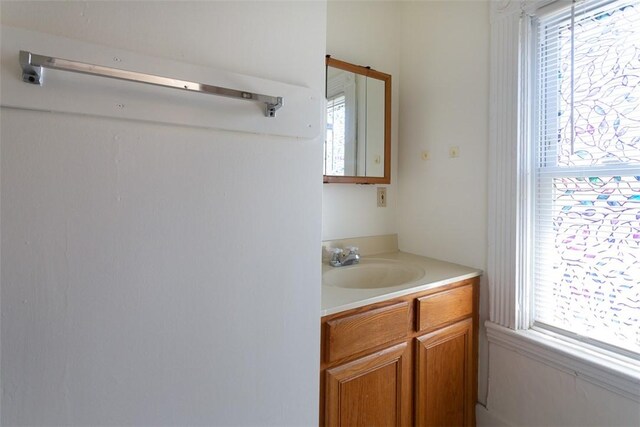 bathroom with a wealth of natural light and vanity