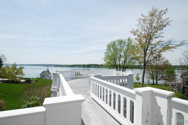 wooden deck featuring a water view