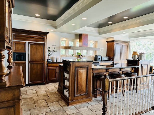 bar with recessed lighting, stone tile flooring, a raised ceiling, and crown molding