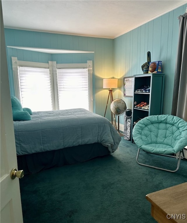 carpeted bedroom with ornamental molding