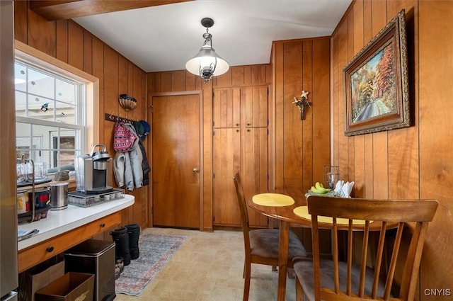 dining space with wooden walls