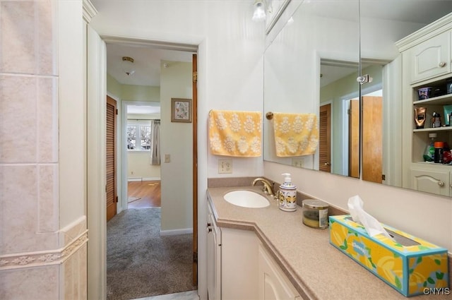 bathroom with vanity and baseboards