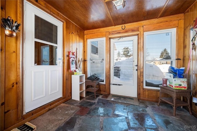 entryway with wooden ceiling and wood walls