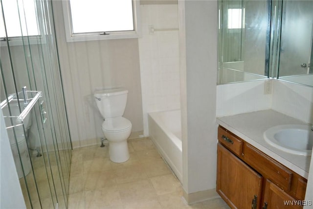 full bathroom featuring a tub to relax in, tile patterned flooring, toilet, vanity, and walk in shower