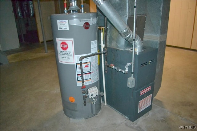 utility room with heating unit and gas water heater