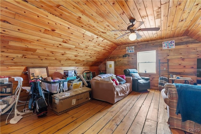 additional living space featuring lofted ceiling, wood walls, light wood-type flooring, and wooden ceiling