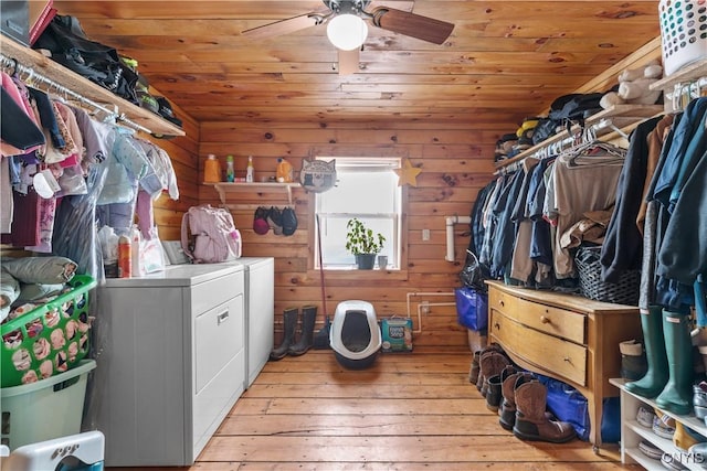 washroom with laundry area, wooden ceiling, light wood-style flooring, and washing machine and clothes dryer