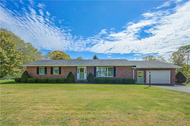 284 Main St, Worcester, NY 12197 - ranch-style house with driveway, an attached garage, a front lawn, and brick siding