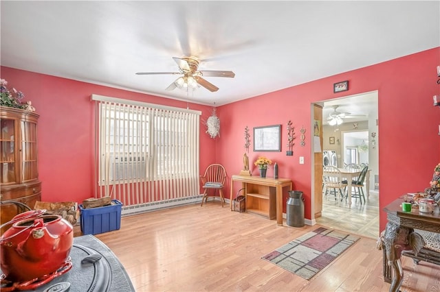 284 Main St, Worcester, NY 12197 - interior space with baseboards, a ceiling fan, baseboard heating, and wood finished floors