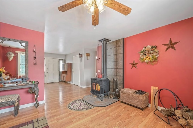 284 Main St, Worcester, NY 12197 - living room with wood finished floors, a wood stove, and baseboards