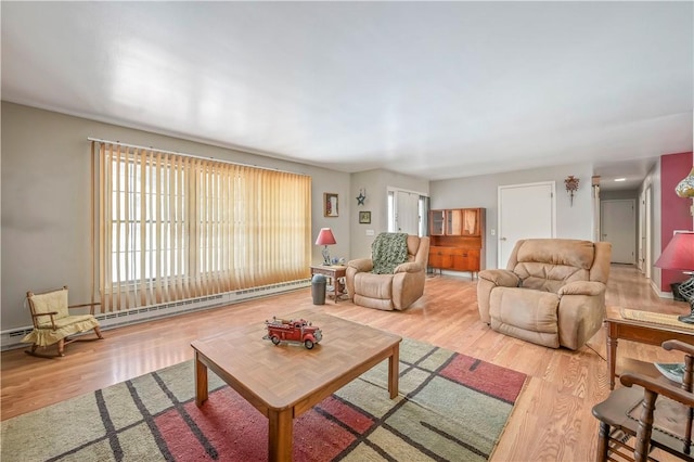 284 Main St, Worcester, NY 12197 - living room featuring plenty of natural light, baseboard heating, and wood finished floors
