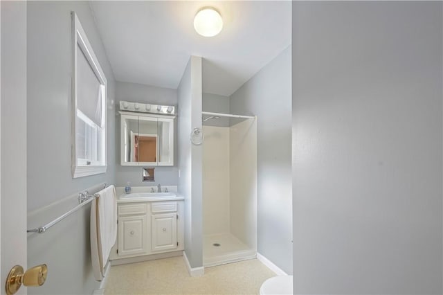 284 Main St, Worcester, NY 12197 - full bathroom featuring toilet, baseboards, walk in shower, and vanity