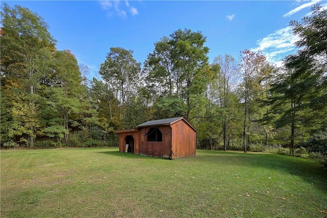284 Main St, Worcester, NY 12197 - view of yard with an outbuilding, a storage unit, and a wooded view