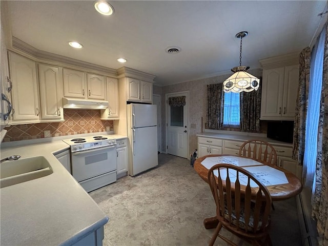 kitchen featuring white appliances, visible vents, a sink, under cabinet range hood, and decorative light fixtures