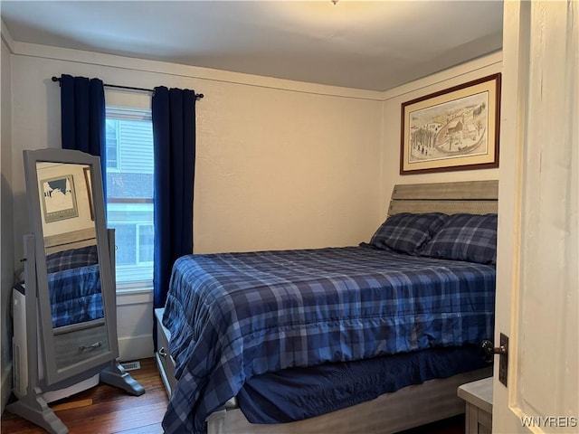 bedroom with wood finished floors