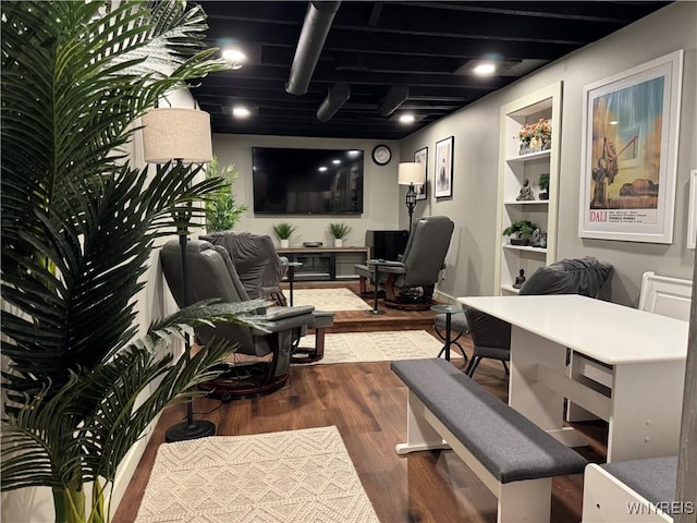 interior space with wood finished floors and baseboards