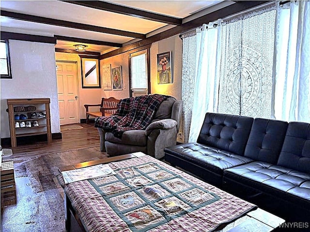 living room featuring wood finished floors and beam ceiling