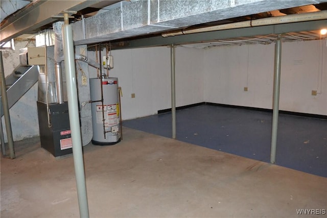 unfinished basement featuring water heater