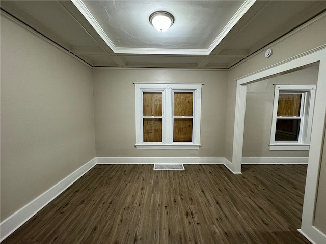 spare room featuring dark wood-style floors, visible vents, and baseboards