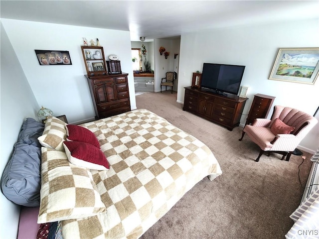 bedroom featuring carpet floors and baseboards