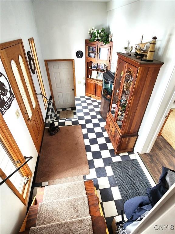 interior space featuring dark floors and stairs