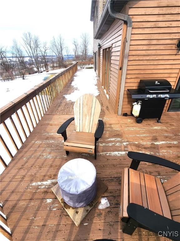 wooden terrace with area for grilling