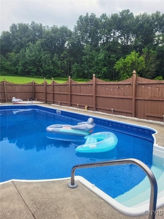 view of swimming pool featuring a fenced in pool and a fenced backyard