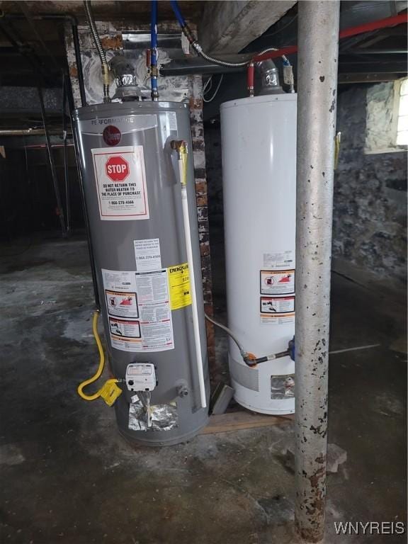 utility room with gas water heater