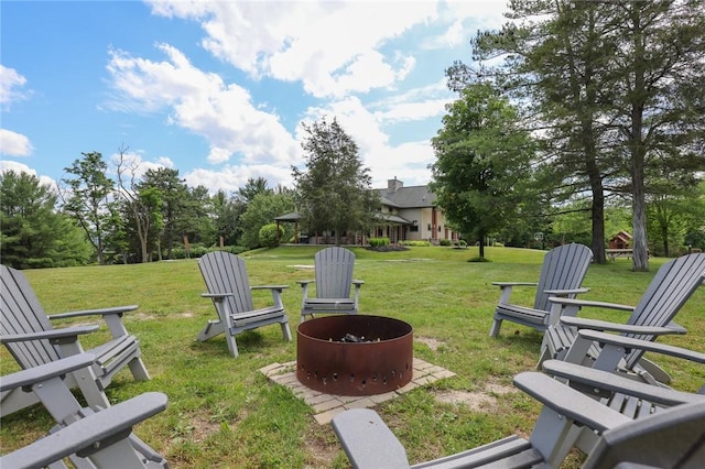 view of yard with an outdoor fire pit