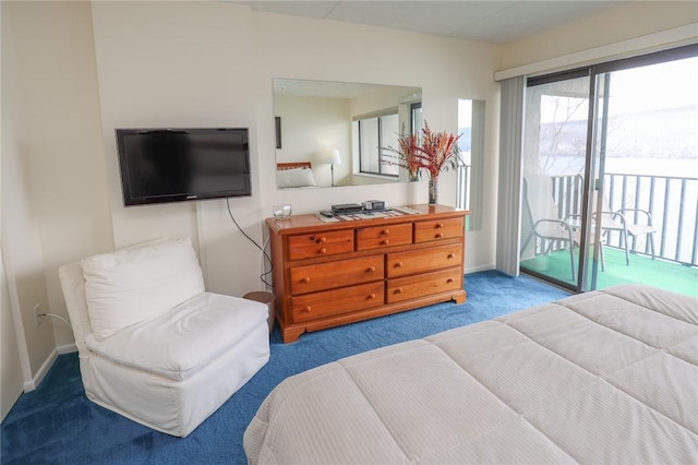 carpeted bedroom featuring access to exterior and baseboards