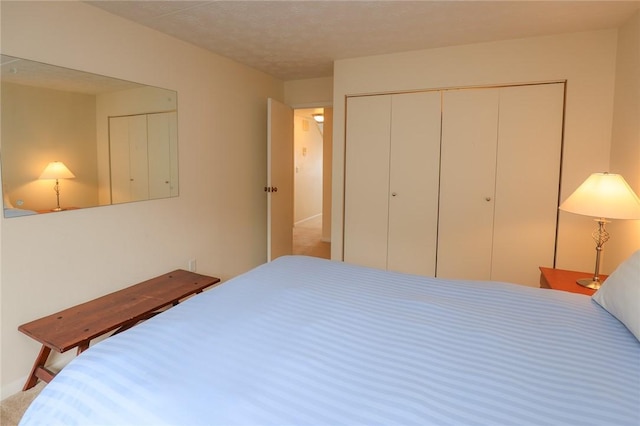 bedroom with a closet and a textured ceiling