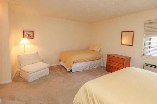 carpeted bedroom with baseboards