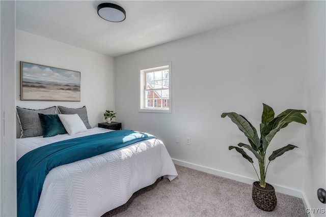 carpeted bedroom with baseboards